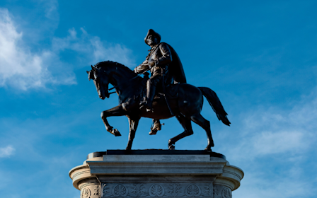 A statue of a person riding a horse.