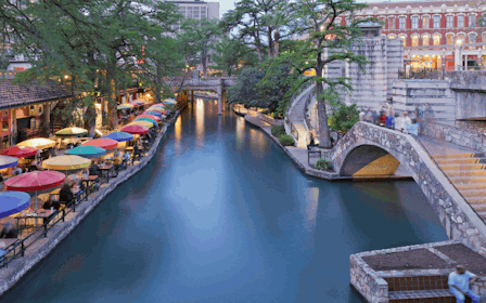 A canal with a bridge and buildings.