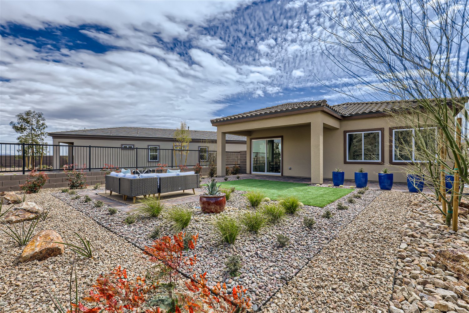 A house with a gravel yard.