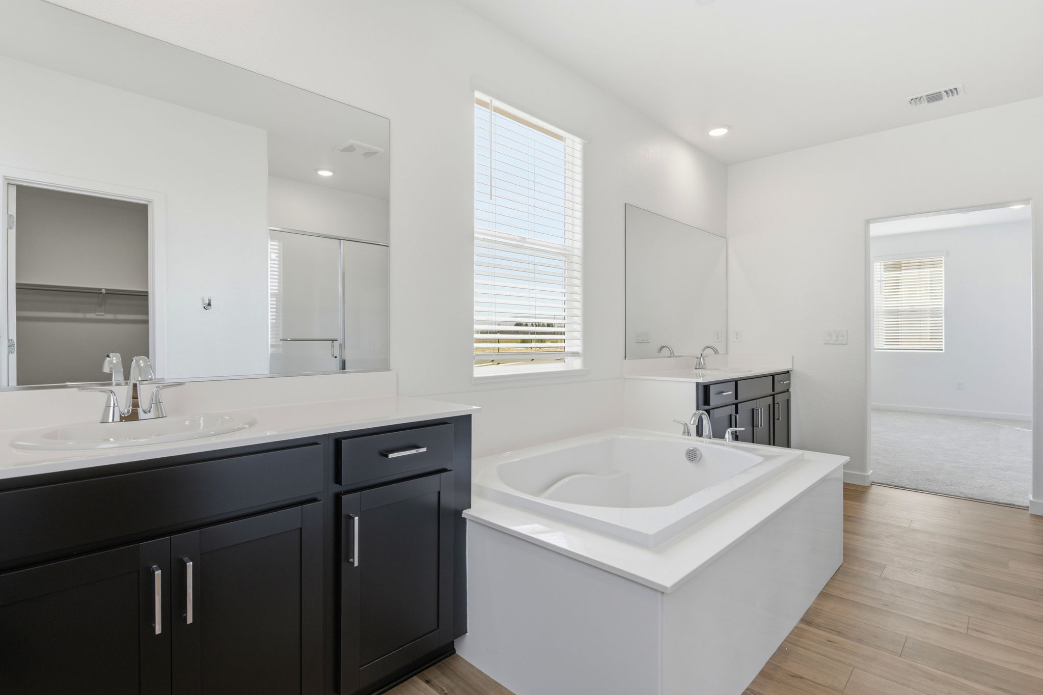 A bathroom with a tub and sink.