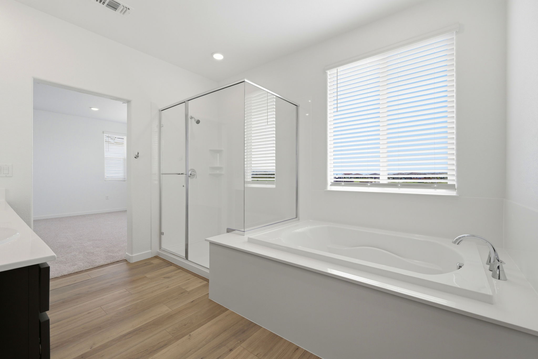 A bathroom with a tub and a sink.