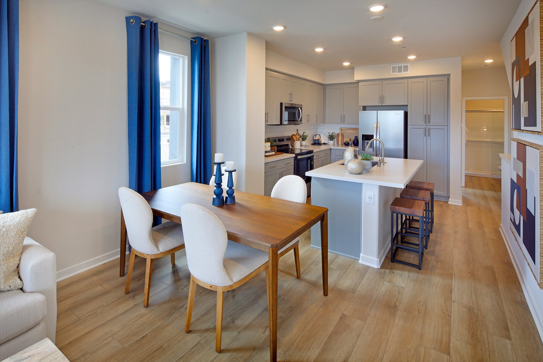 A kitchen with a dining table.