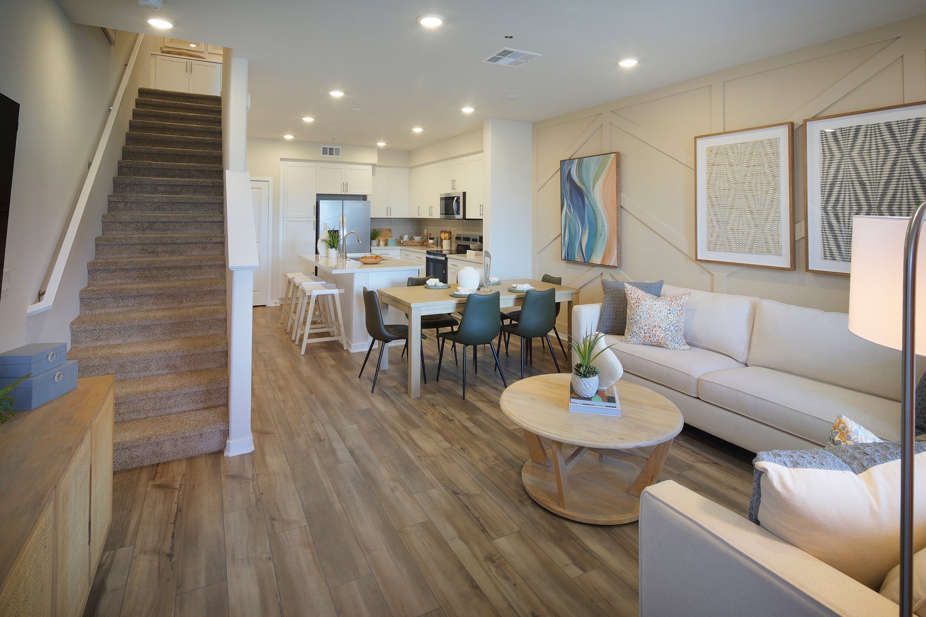 A living room with a wood floor.