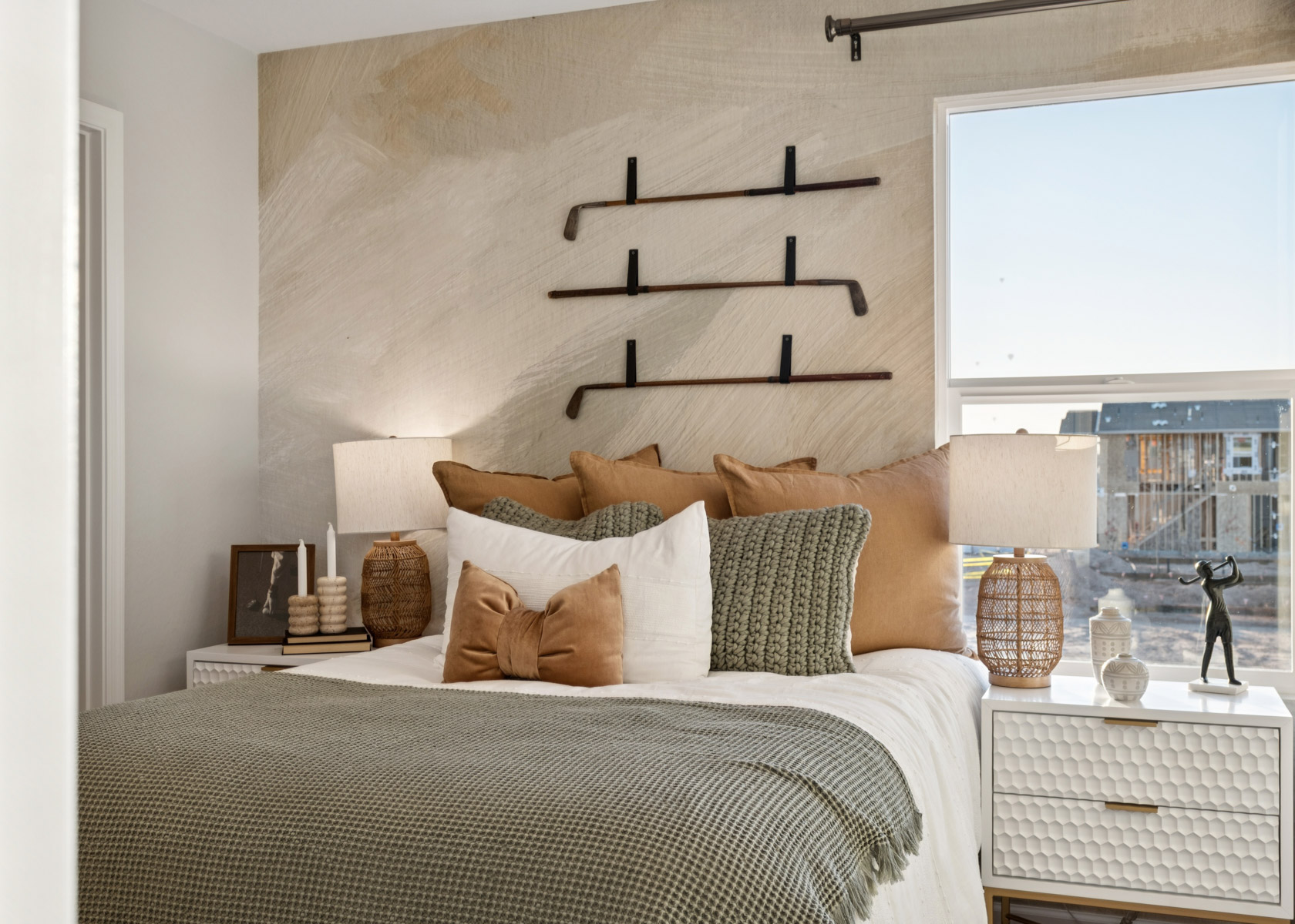 A bed with a large window.