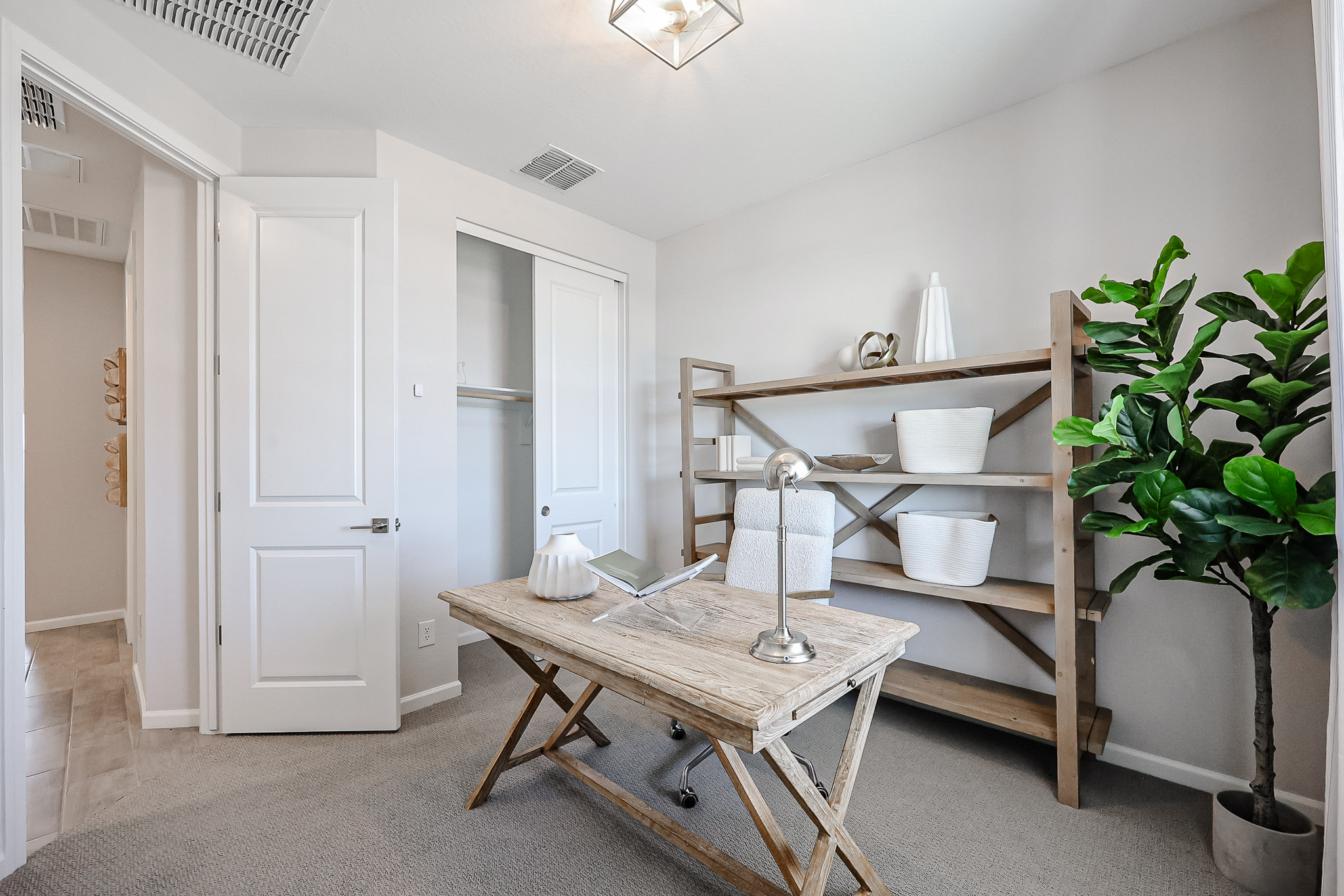 A room with a table and shelves.