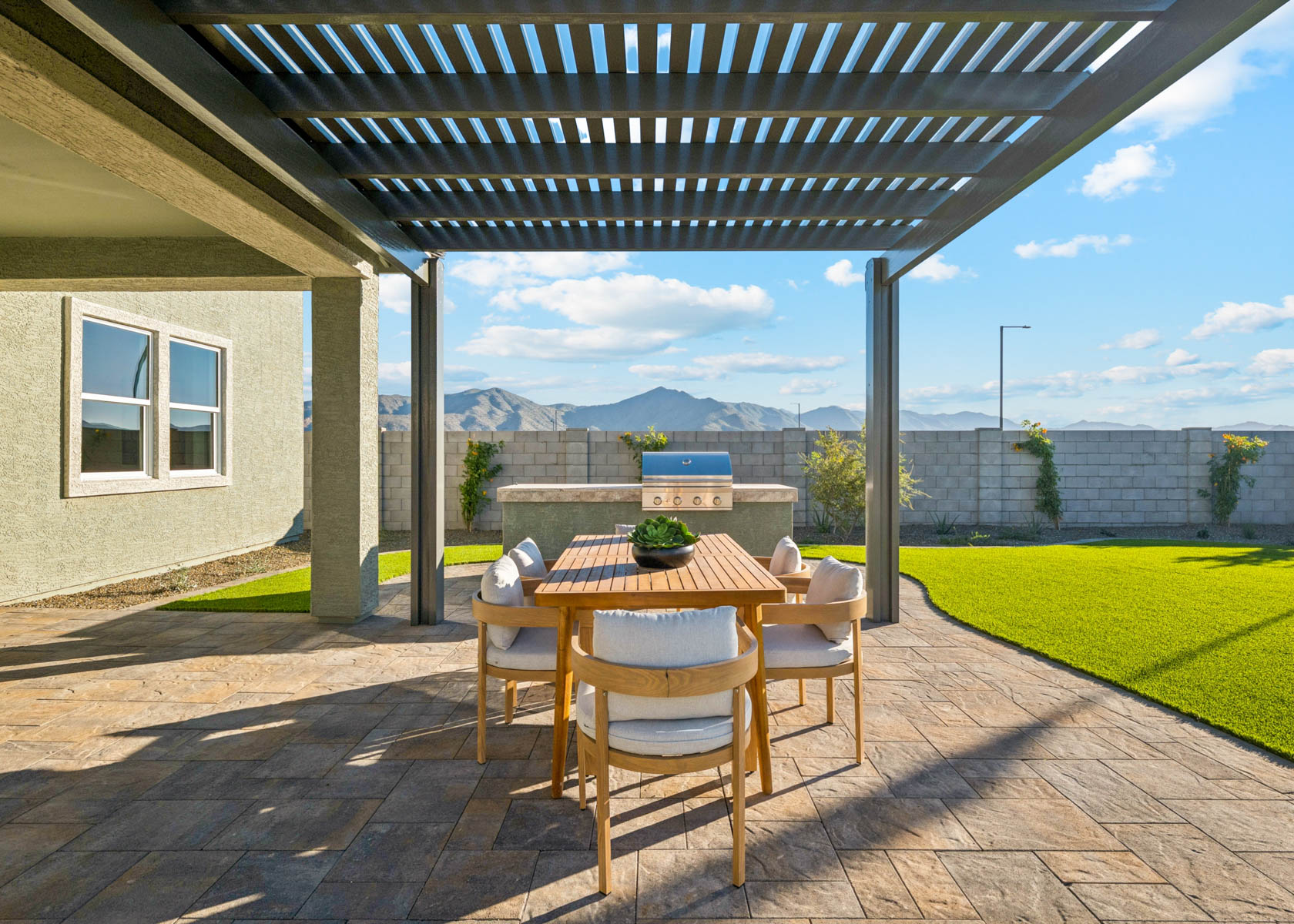 A table and chairs on a deck.