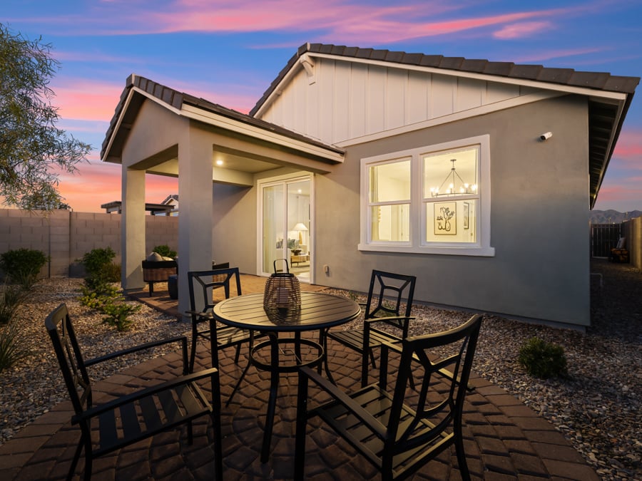 A patio with a table and chairs.