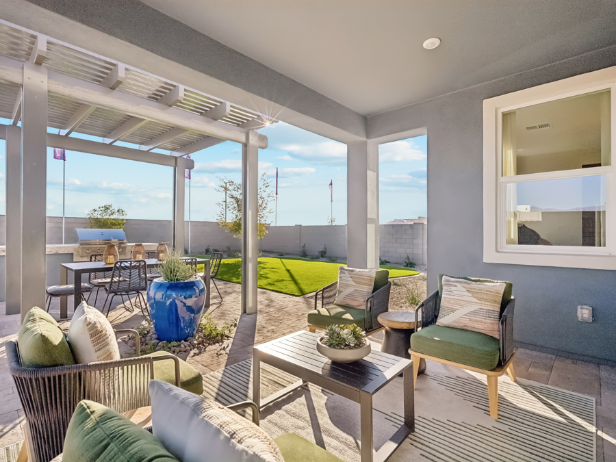 A living room with a view of the ocean.
