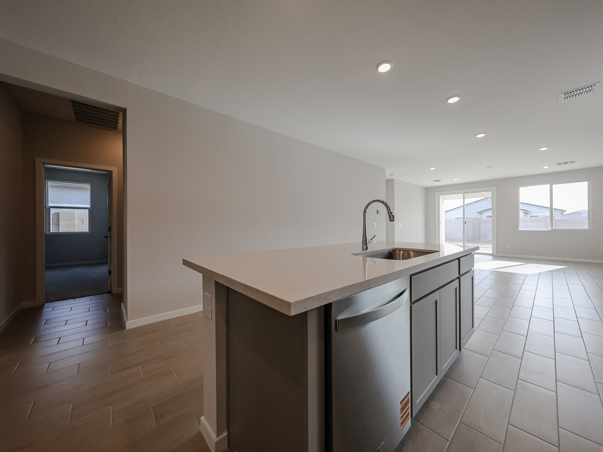 A kitchen with a sink and a counter top.