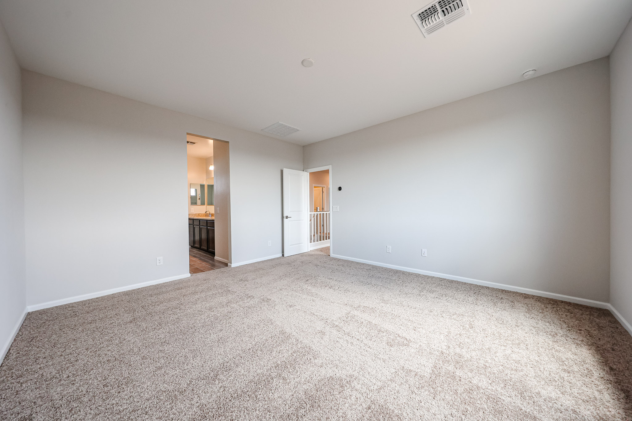 A long hallway with white walls.