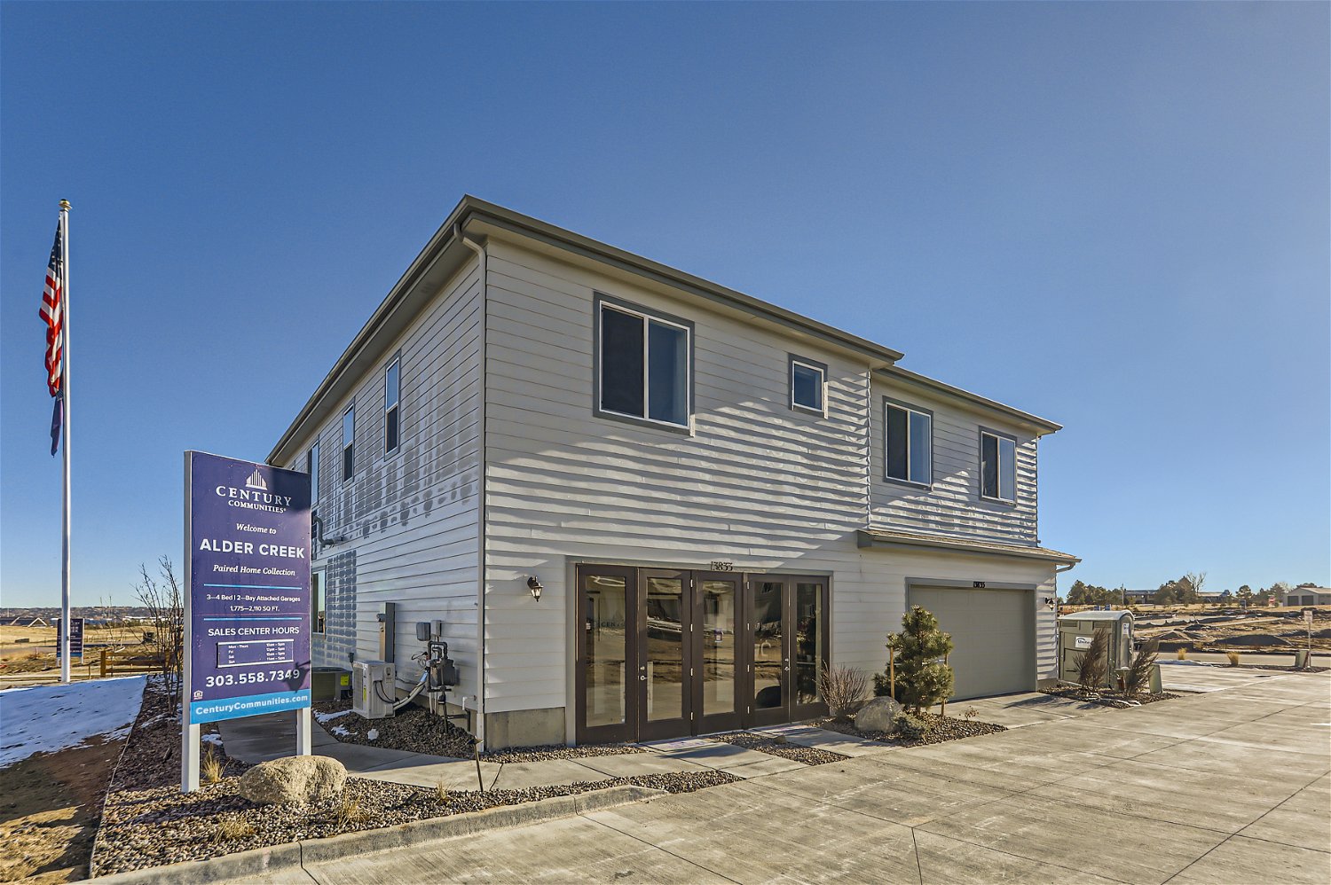 A house with a sign in front.