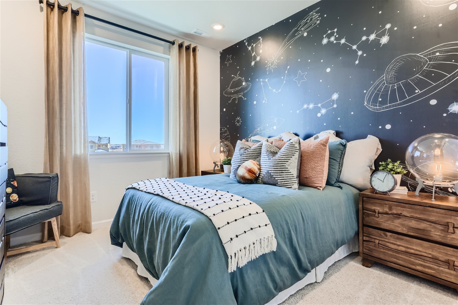 A bedroom with a bed and a window.