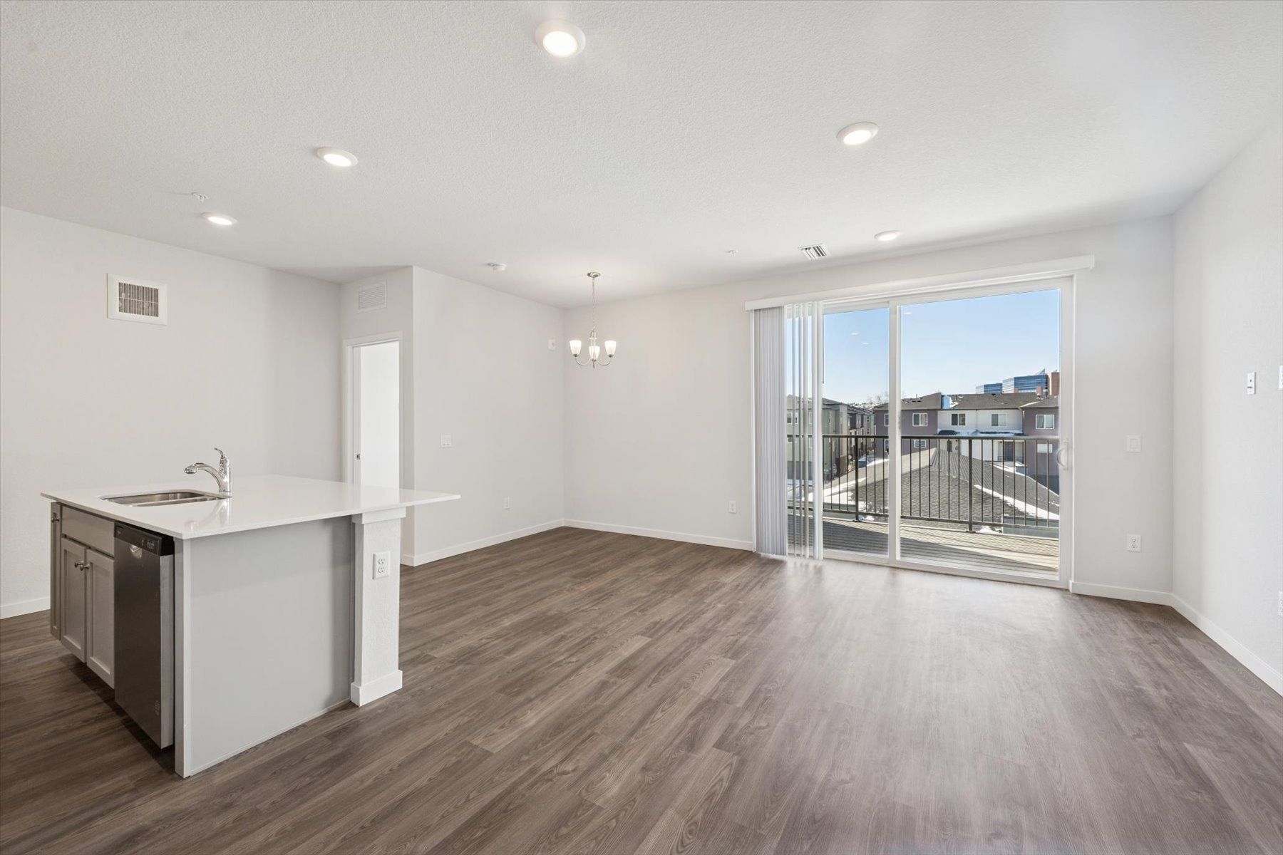 A kitchen with a wood floor.
