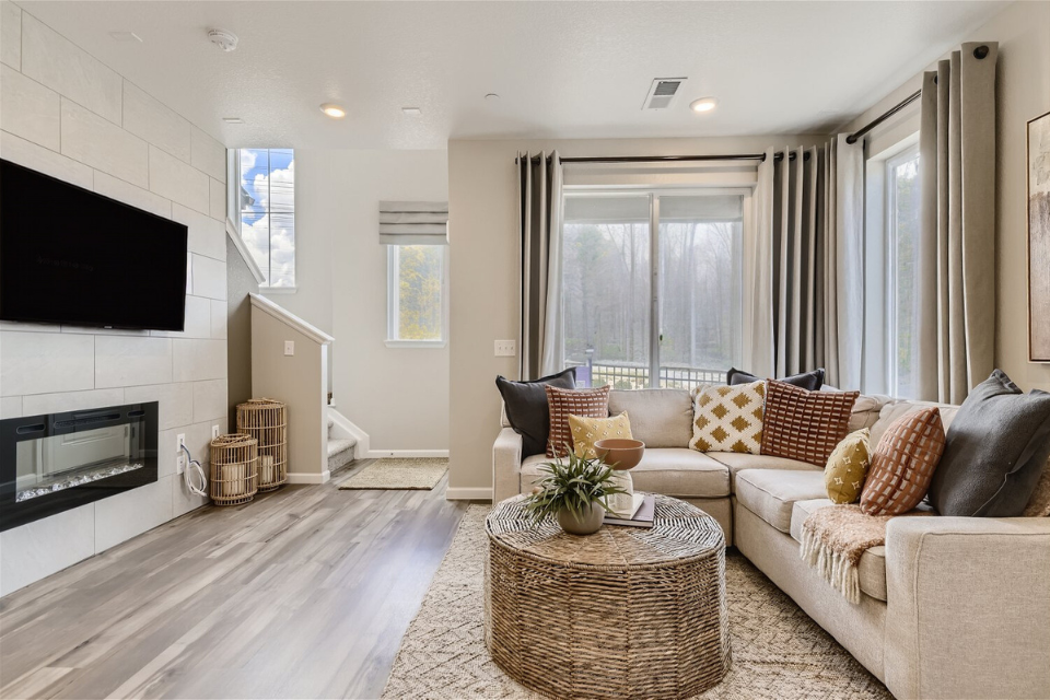 A living room with a fireplace.