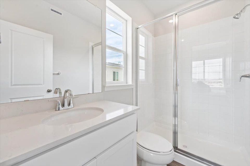 A bathroom with a glass shower.