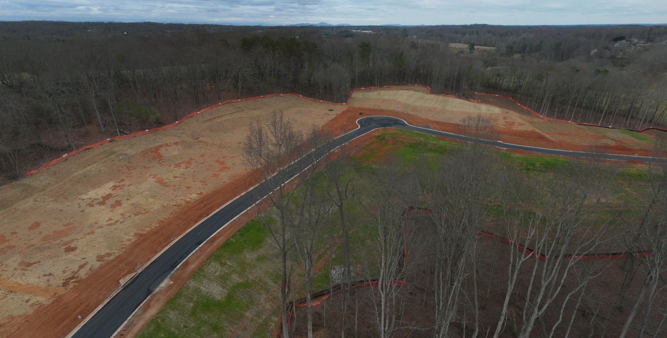 A road with trees on the side.