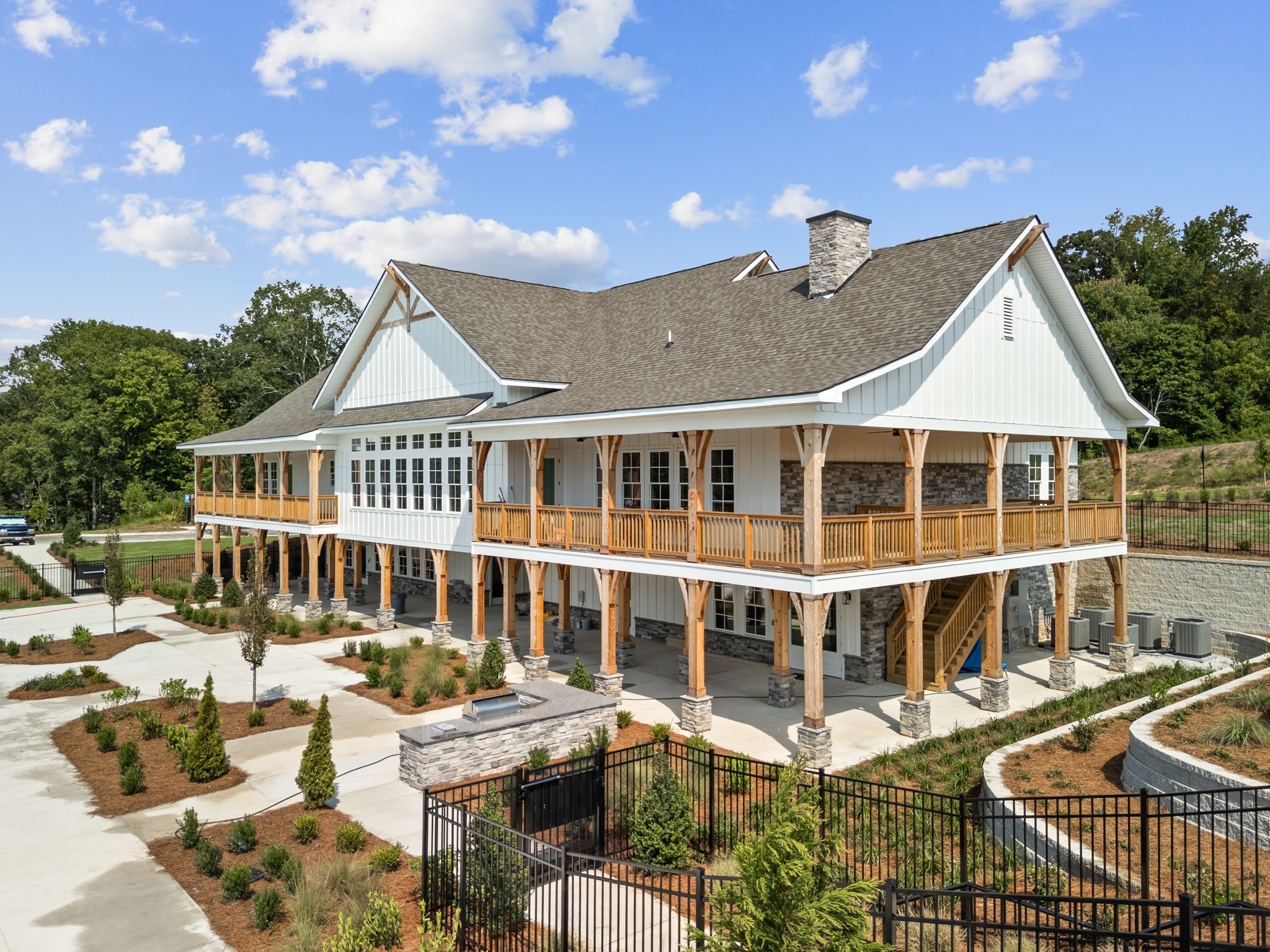 A large house with a fence around it.