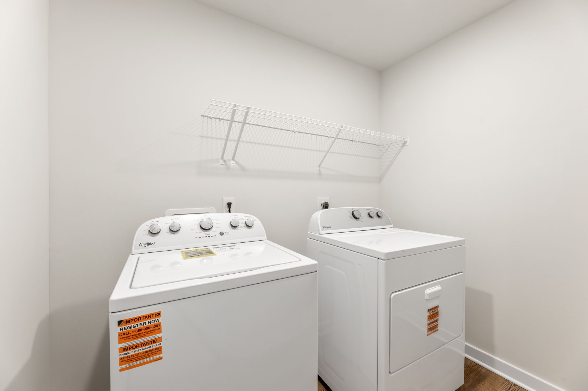 A washing machine in a room.