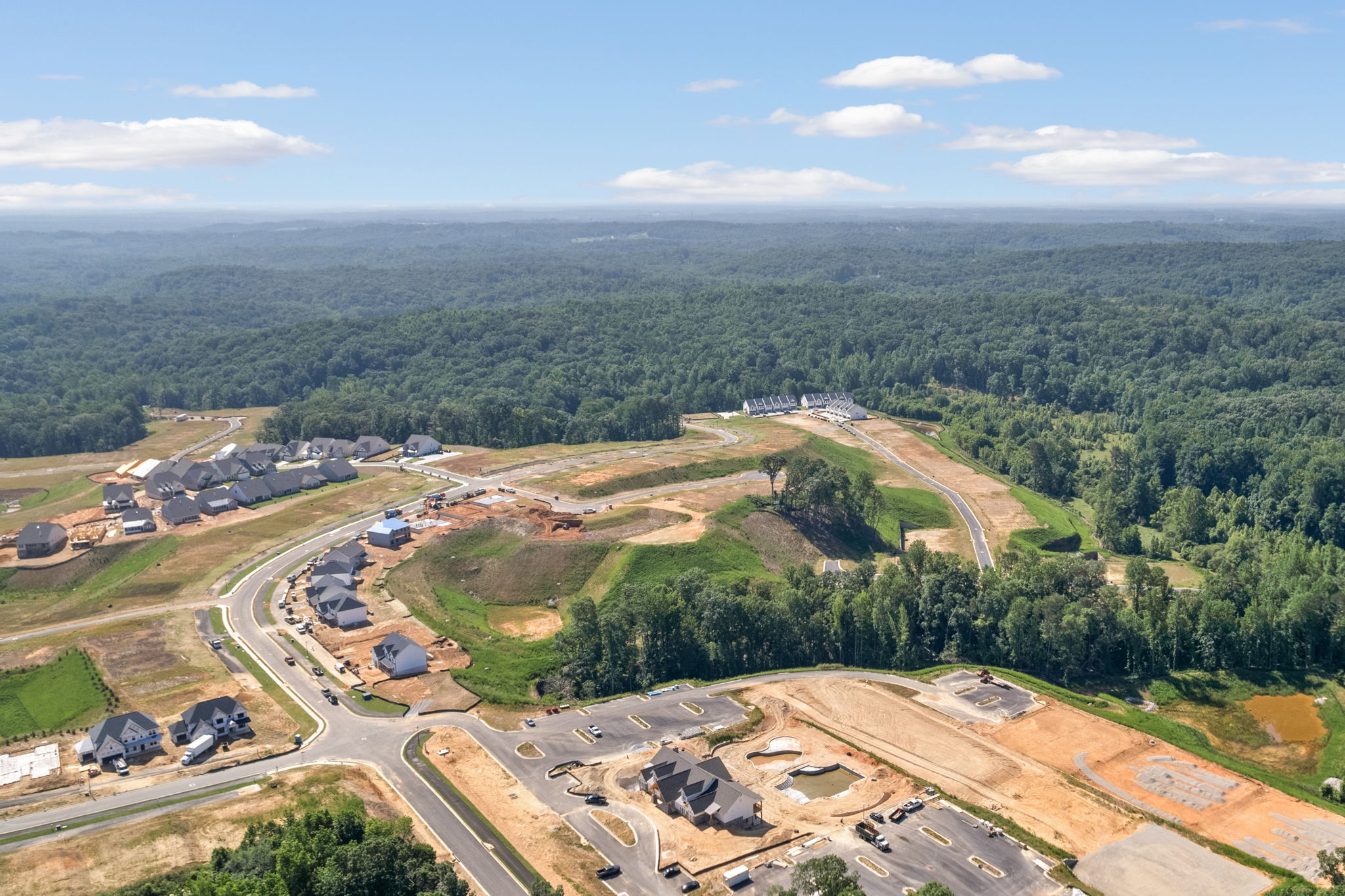 A landscape with a road and trees.