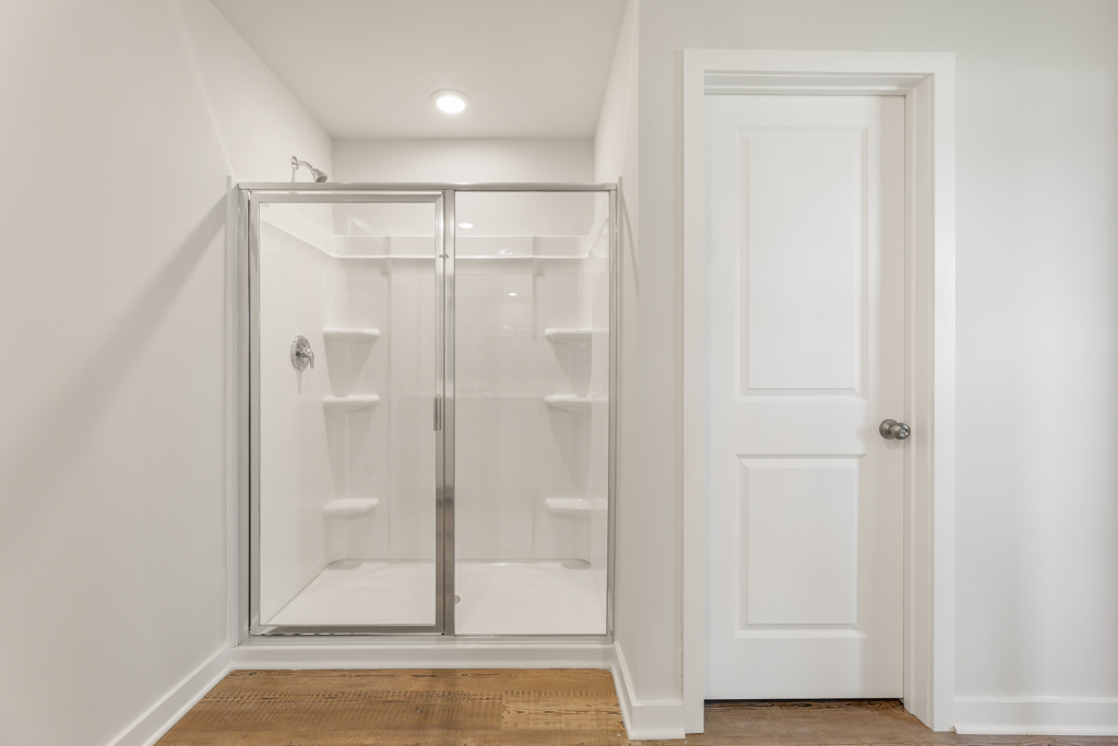 A bathroom with a glass shower.