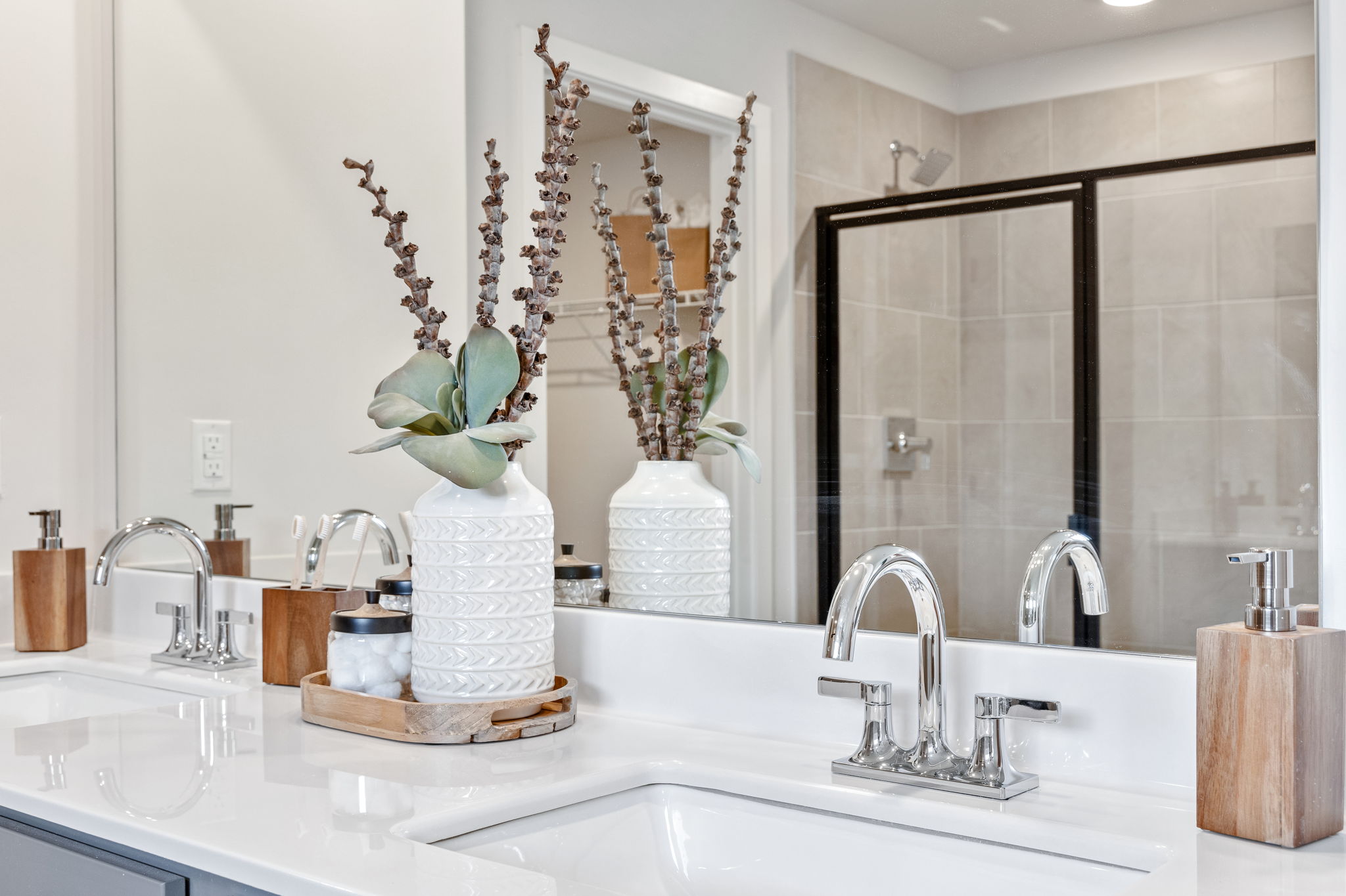 A bathroom with a large mirror.