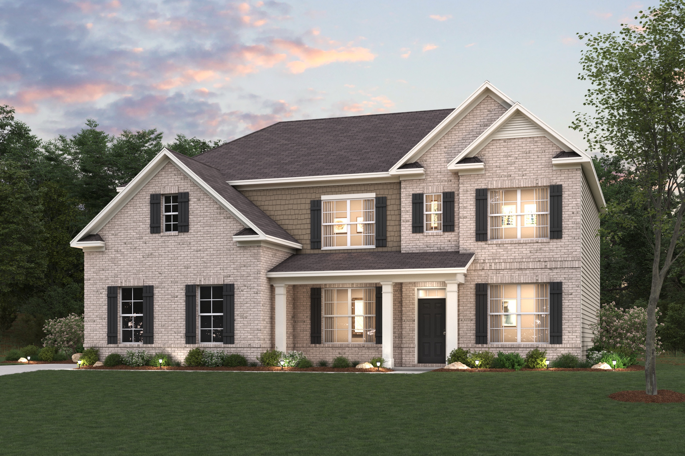 A large house with a lawn in front of it.