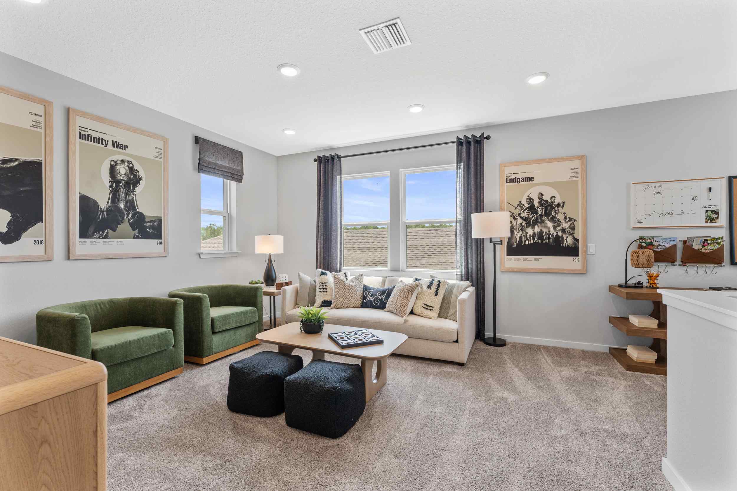 Silverbell II Model Home Loft with Couch and Chairs at Camden Woods in Kingsland, GA