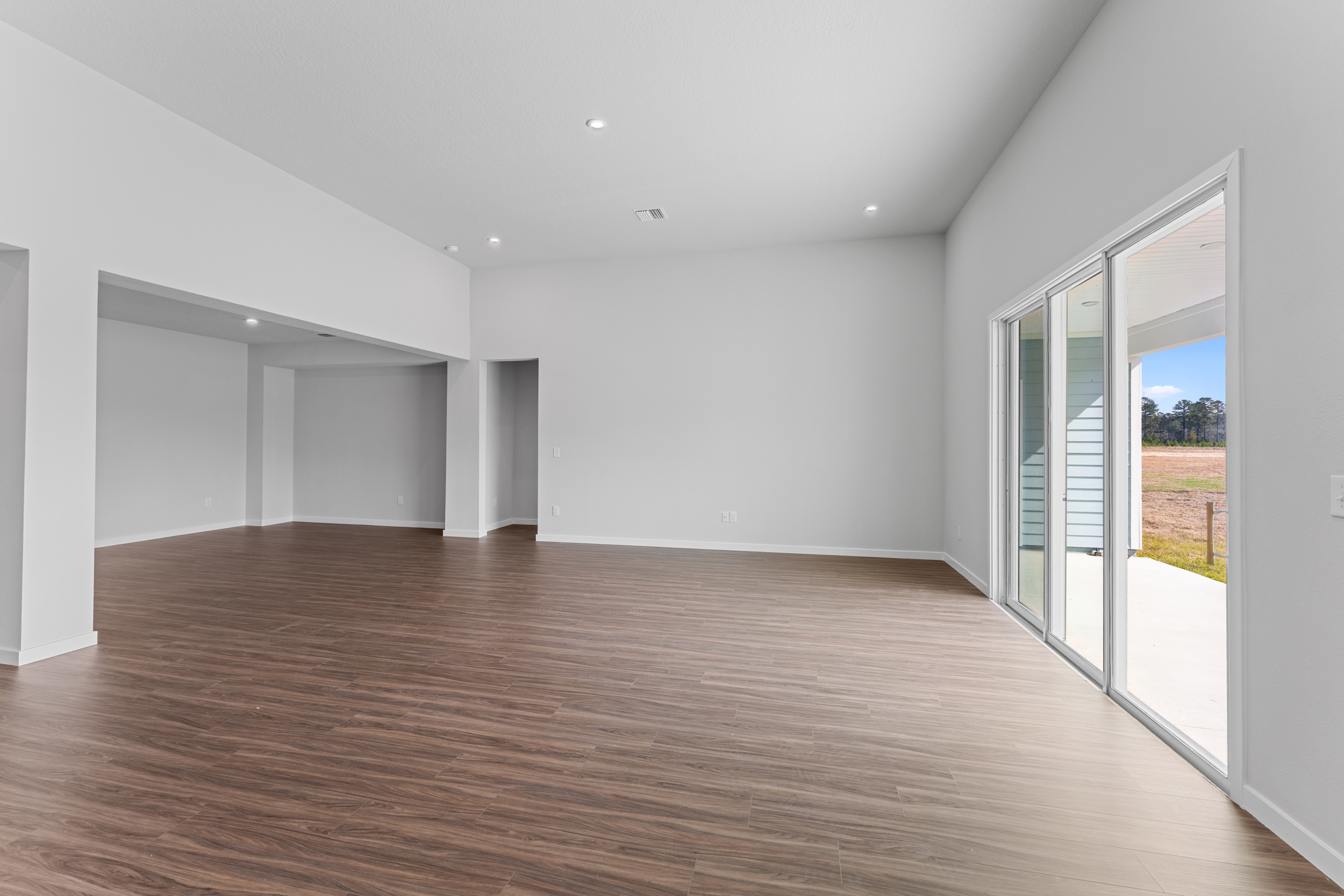 Lot 592 Living Area with 12' Ceilings and Sliding Glass Doors to Patio at NorthShore