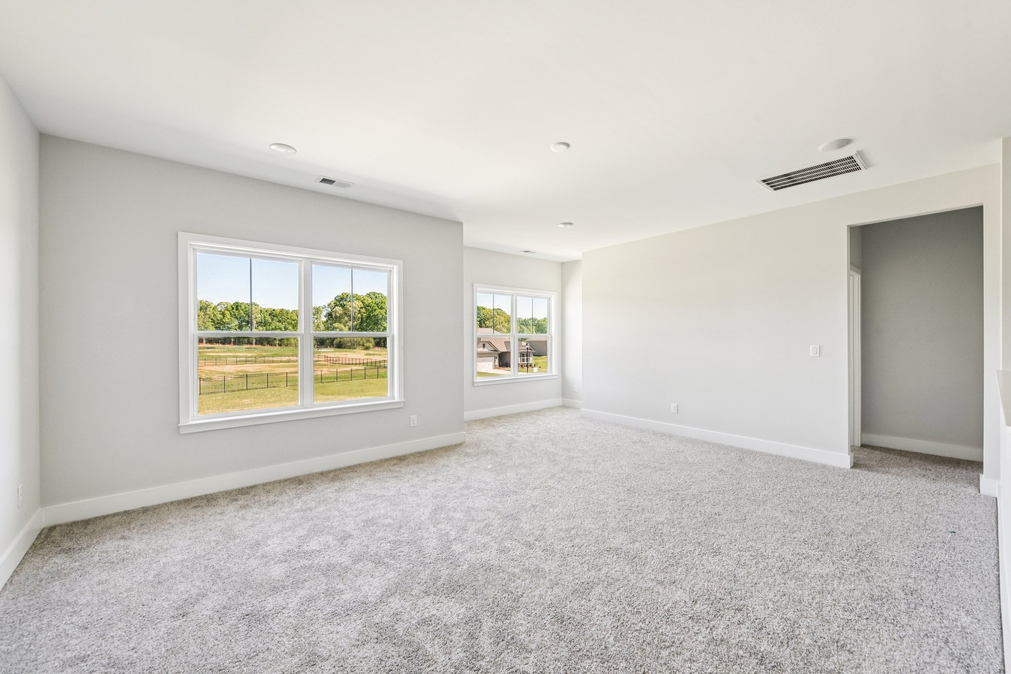 A room with a window and a door.