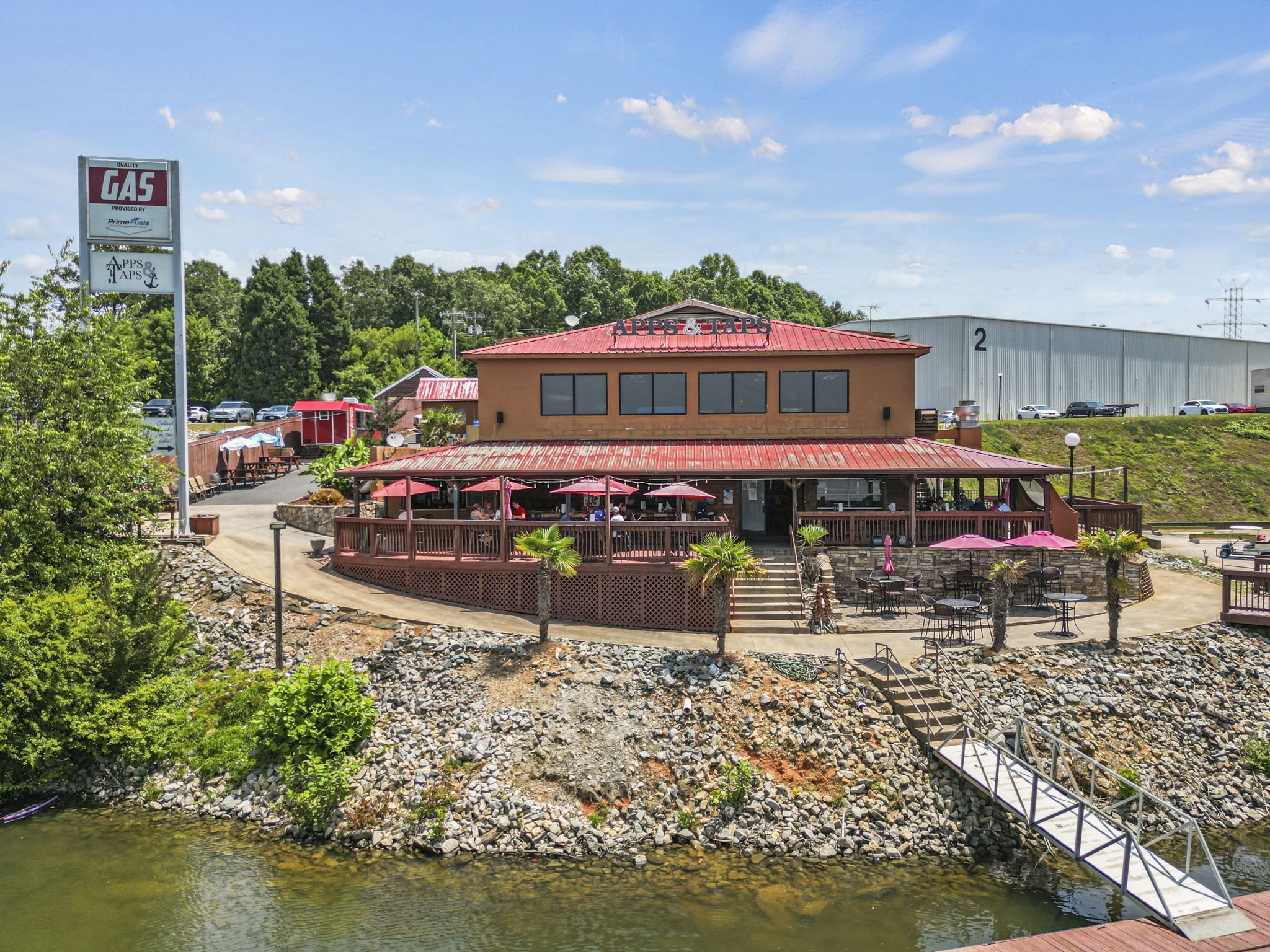 A building with a pond in front of it.