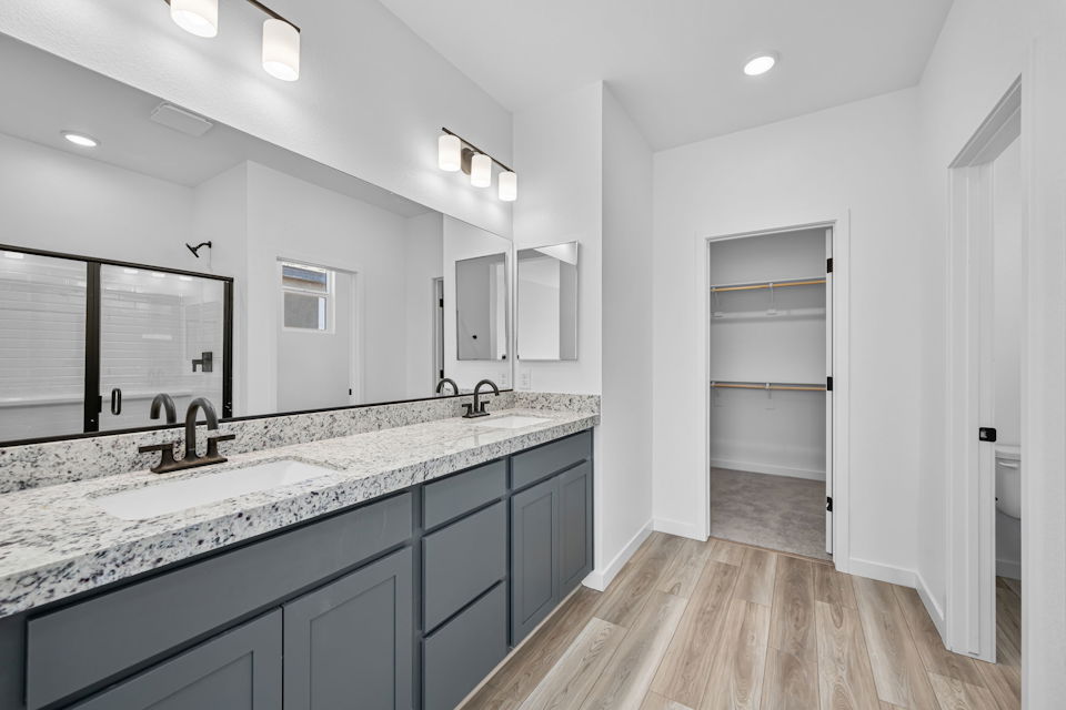 A modern bathroom with a marble countertop.