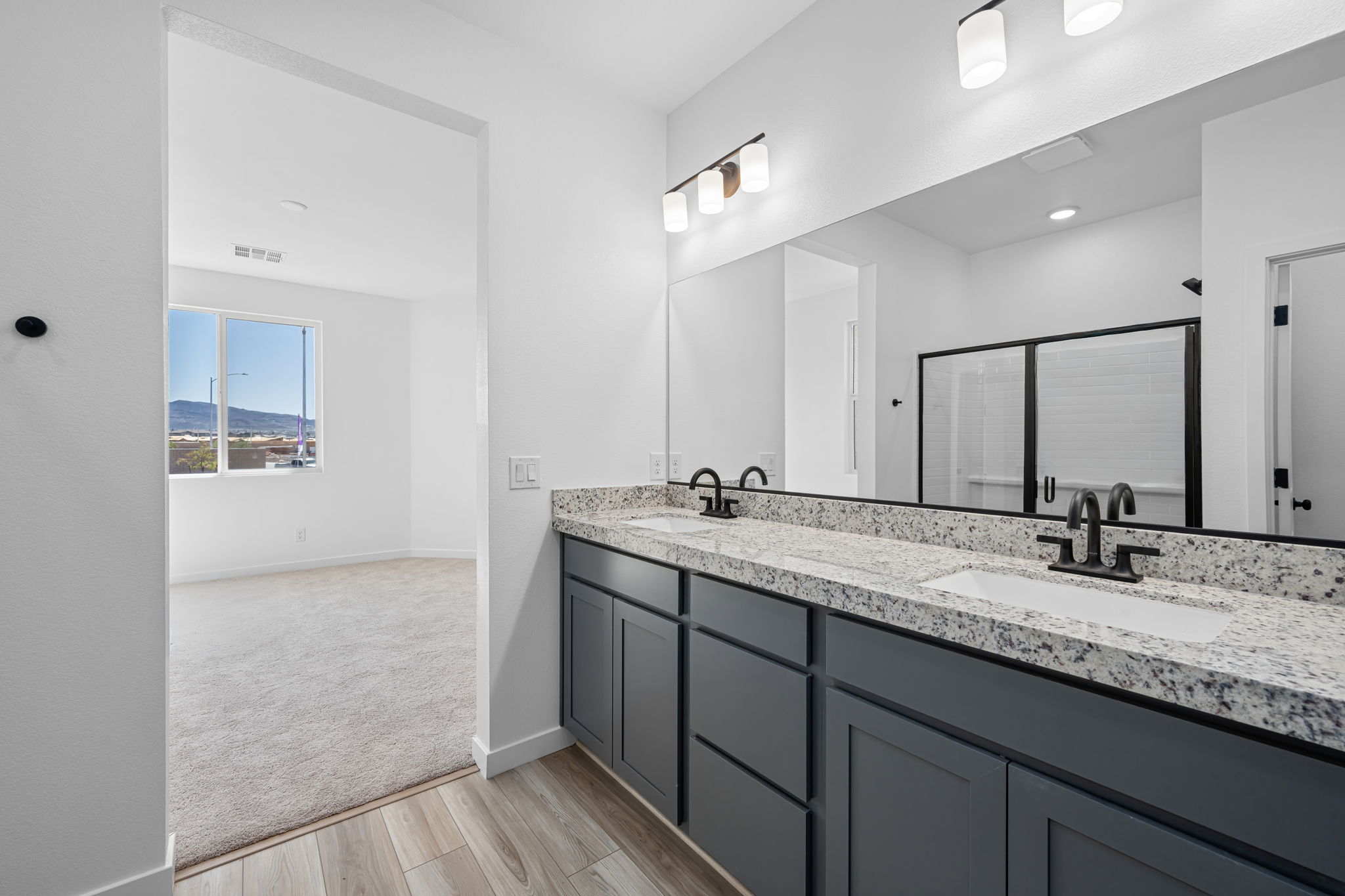 A bathroom with a marble countertop.