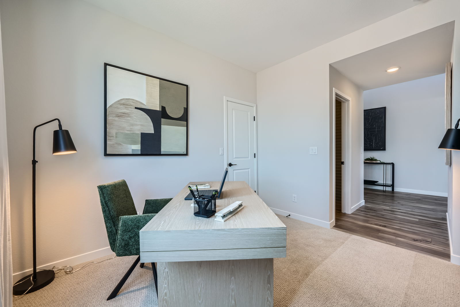 A room with a table and chairs.