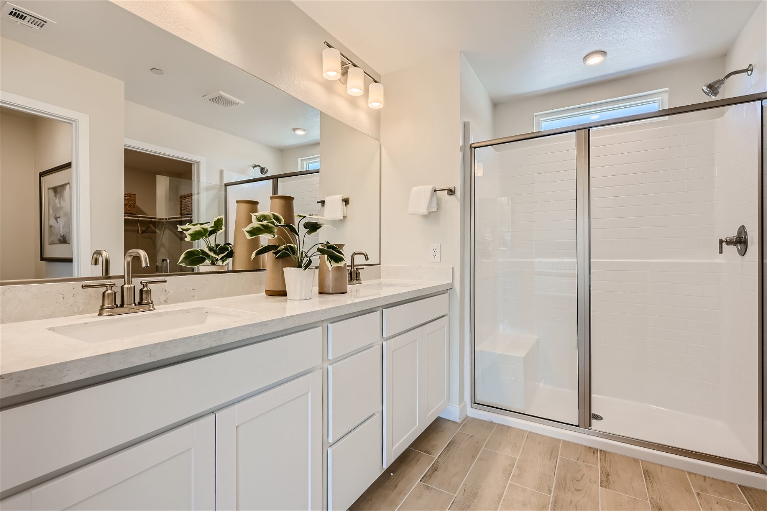 A bathroom with a glass shower.