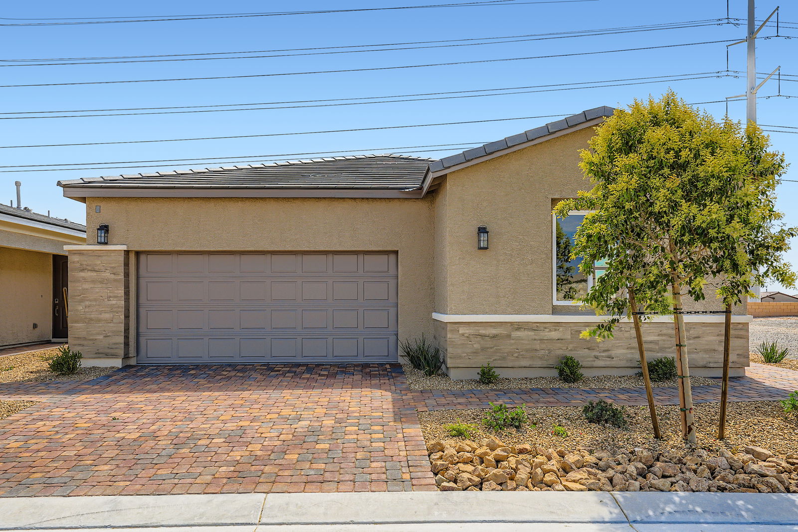 A house with a brick driveway.