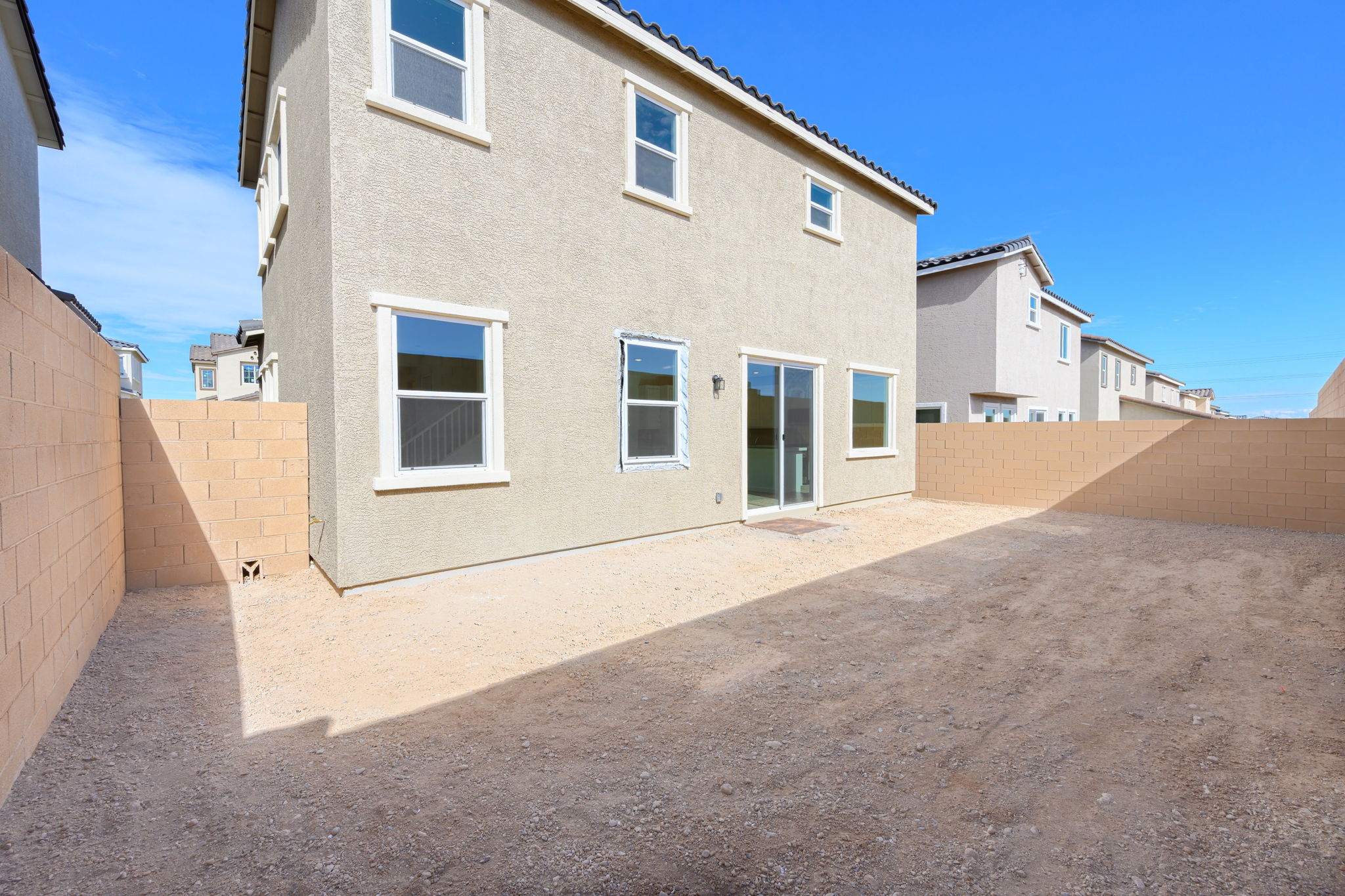 A building with a dirt road.