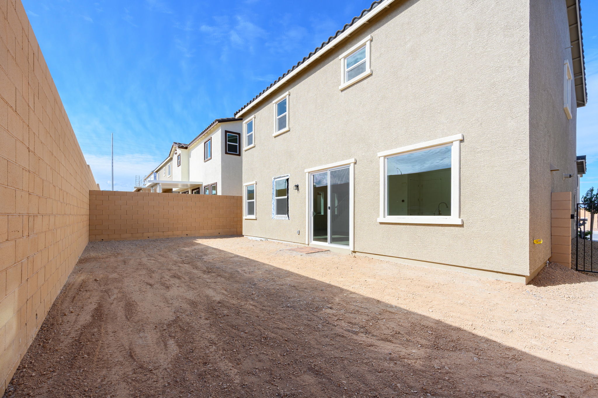 A building with a dirt road.
