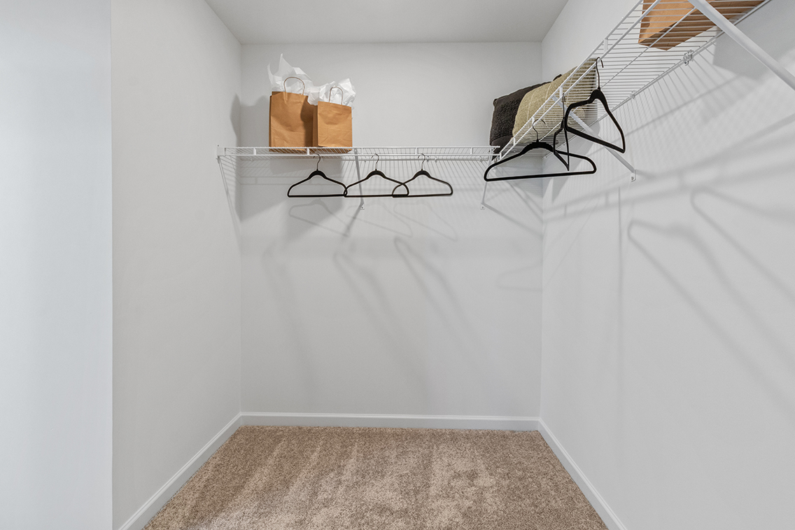 A room with a chair and a table.