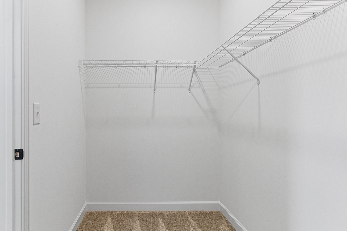 A white staircase in a room.