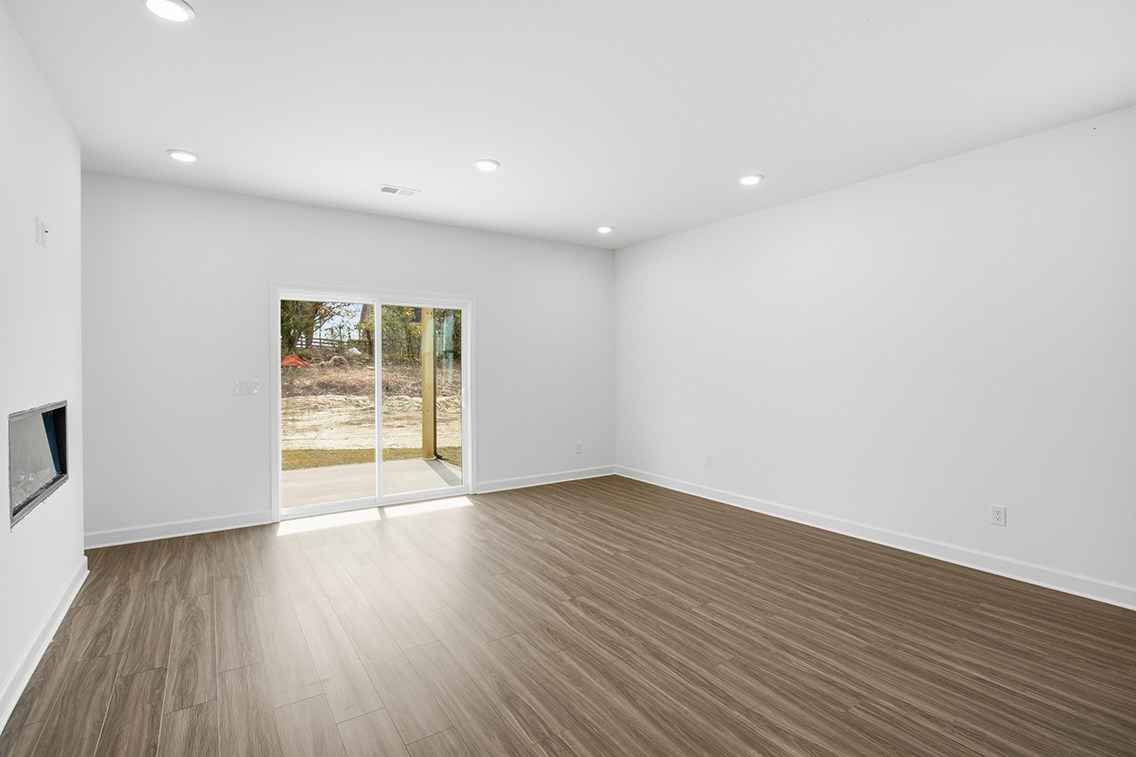 A room with a wood floor and a wood floor.