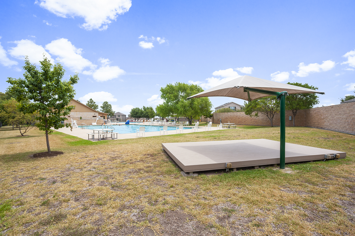 A swimming pool with a covered area.