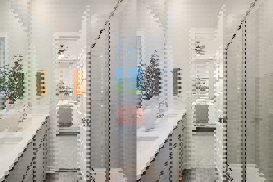 A bathroom with a glass shower.