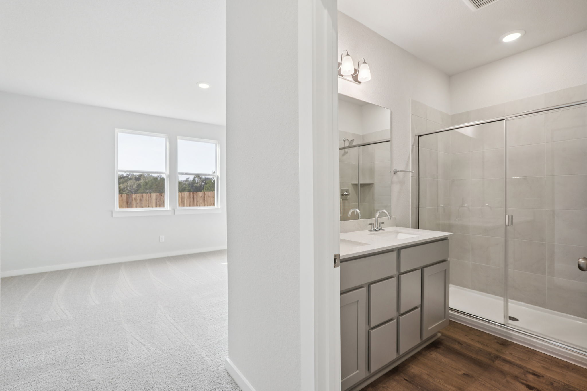 A bathroom with a glass shower.