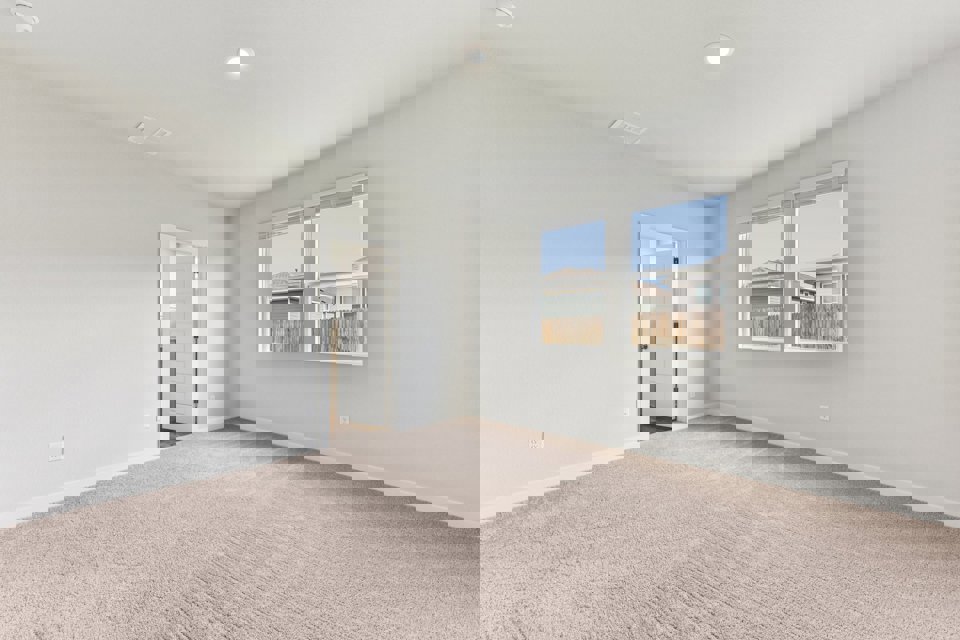 A room with a window and a door.