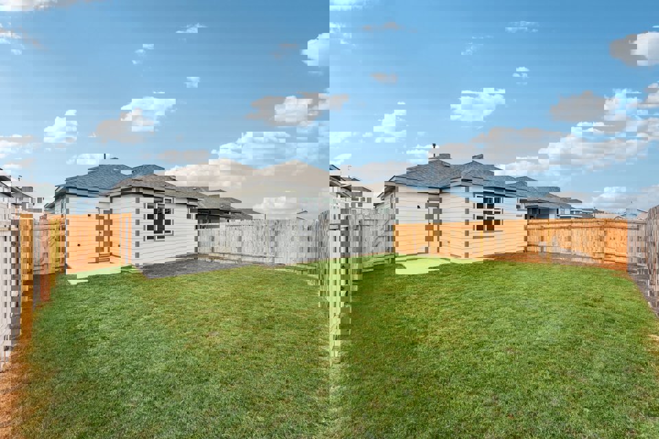 A house with a fence around it.