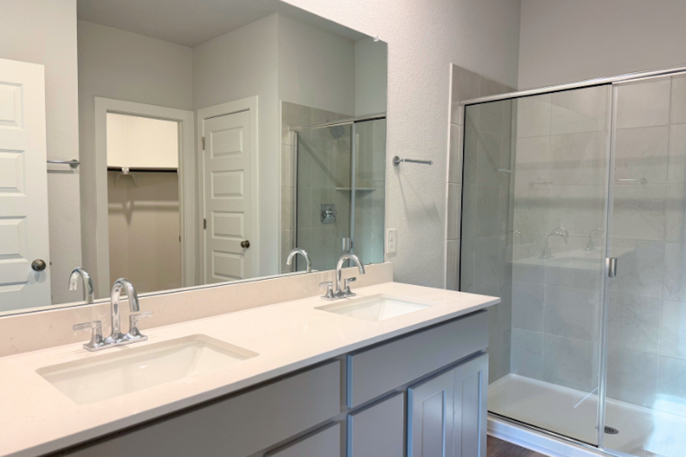 A bathroom with a glass shower.