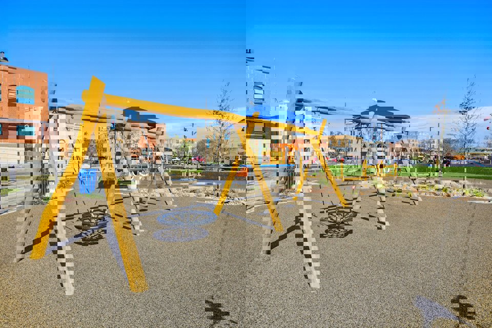 A playground with yellow slide.