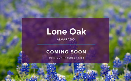 A sign in a field of flowers.