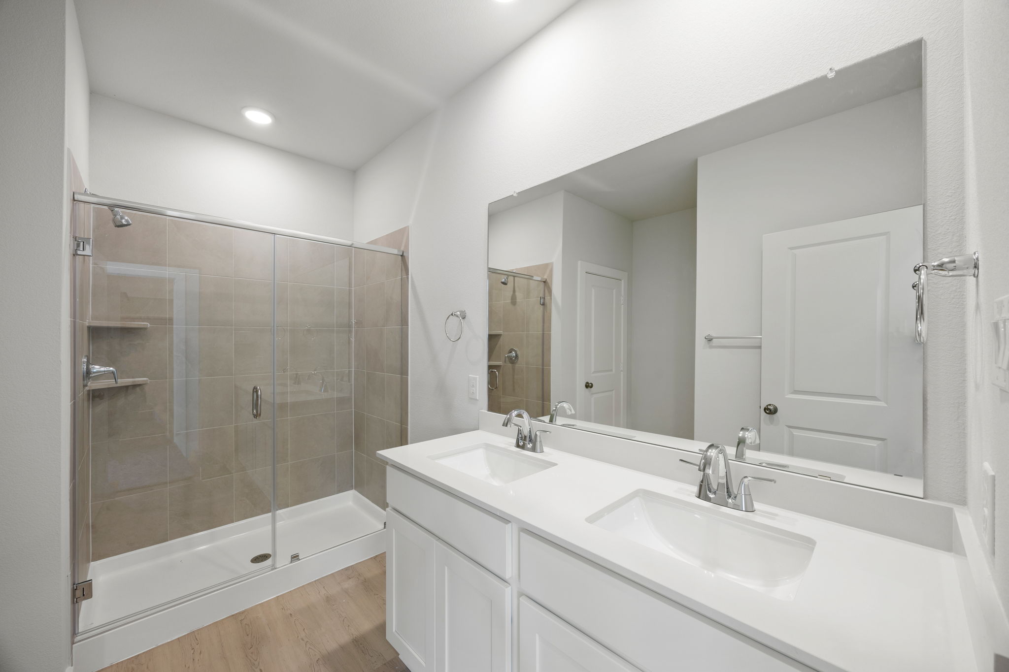 A bathroom with a glass shower.