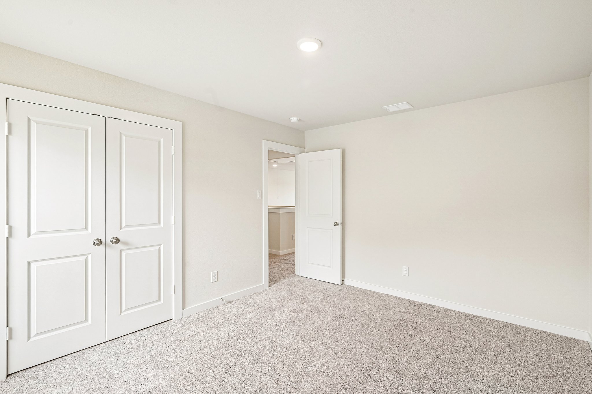 A room with white doors.